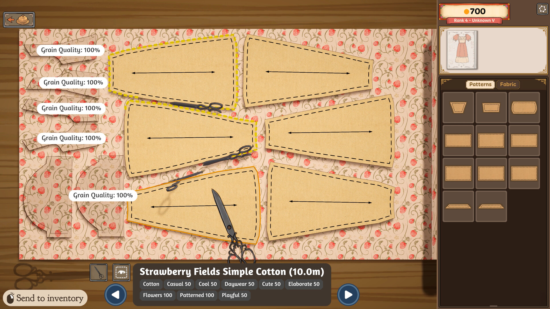 Official Dressmaker screenshot of the cutting table, with dress panels laid out on a bolt labelled Strawberry Fields Simple Cotton 10.0m, each panel tagged Grain Quality 100%, a coin balance of 700 in the corner and a fabric panel listing style tags such as Flowers 100 and Patterned 100