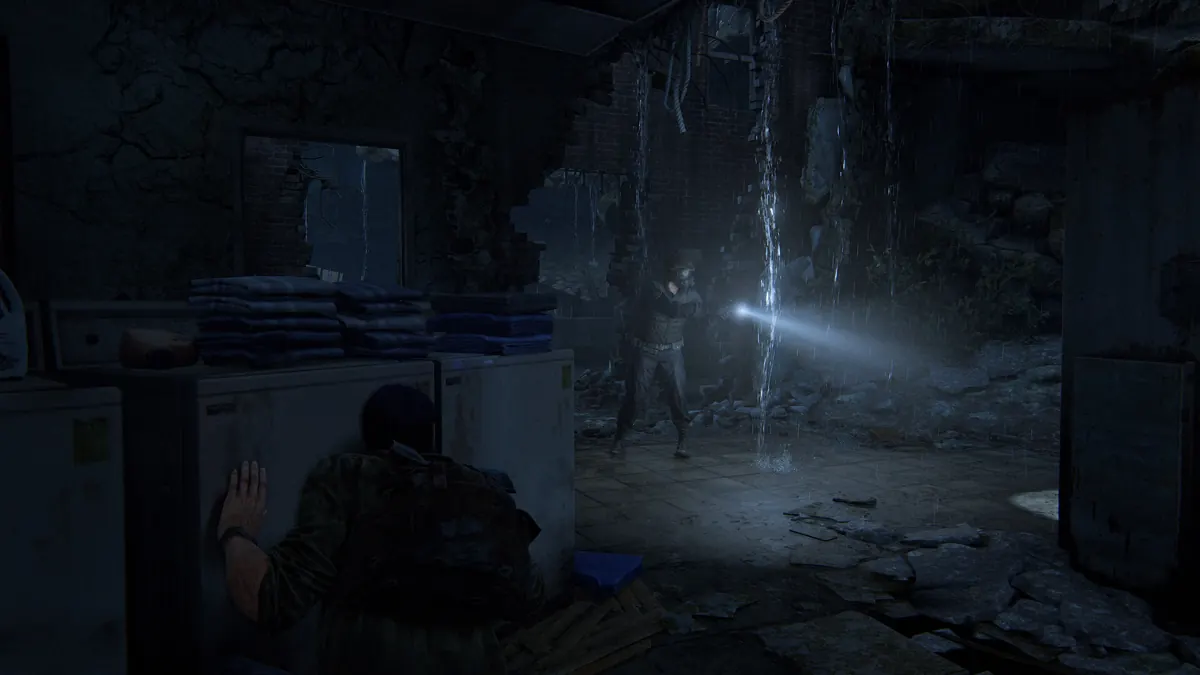 A dark ruined interior in The Last of Us Part I